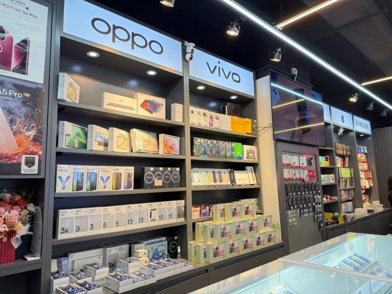 Shelves of boxed smartphones from popular brands